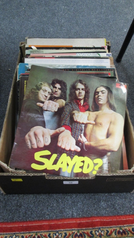 A box of 33rpm records, various genres, including Pink Floyd, Led Zeppelin, etc