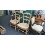 A pair of Continental beech rush seated ladder back armchairs