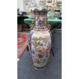 A large 20th century Japanese porcelain floor vase, decorated with reserves of figures and
