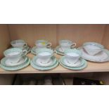 A Paragon six place tea service, comprising cups, saucers and side plates, cake plate and sugar,