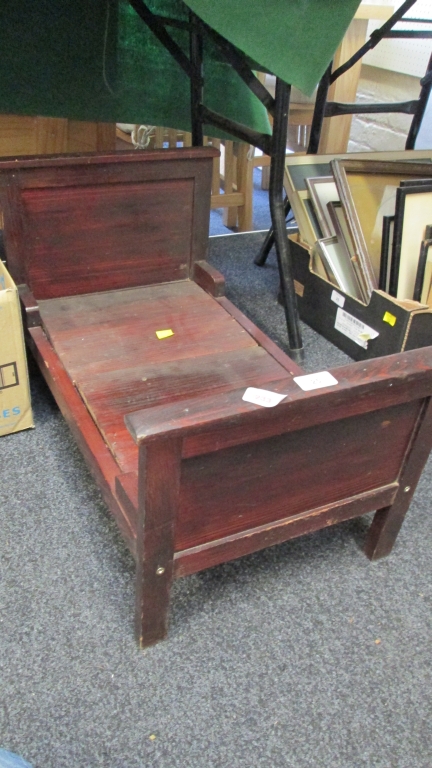 An early 20th century dolls cot (sectional)