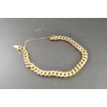 A yellow metal (tests as 9ct gold) chain link bracelet - approx weight 10.9g CONDITION REPORT: