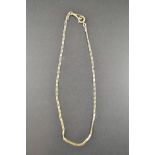 A gold (tests as 14k) flat link watch chain - L42cm, approx weight 14g  CONDITION REPORT: Good
