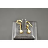 A pair of yellow metal diamond drop earr