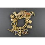 A yellow metal charm bracelet with nineteen charms, mostly 9ct gold - approx total gross weight -
