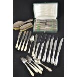 A collection of flatware, mostly plated,