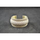 A .925 bangle with interwoven design - approx weight 136g/4.3 troy oz CONDITION REPORT: good