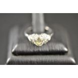 A platinum solitaire ring with diamond s