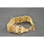 A 9ct gold gate bracelet with padlock clasp - approx weight 32.