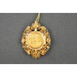 An Edward VII 1907 gold half sovereign in filigree 9ct gold mount, suspended on 9ct gold