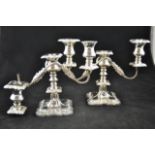 A pair of mid 20th century filled silver two branch table candelabra with cast floral design,