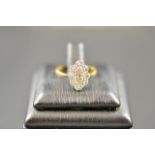 An 18ct gold and platinum ring with diamonds in an Art Deco style marquise setting, size J1/2 -