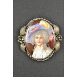 A white metal brooch set with oval porcelain miniature portrait - H 5.5cm. CONDITION REPORT: Good