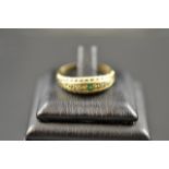 A 9ct gold ring set with an emerald and two diamonds, size Q1/2 - approx gross weight 3g.