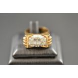 An Art Deco 'Odeonesque' 18k gold ring set with thirty diamonds, size P½.
 CONDITION REPORT: Good