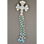 A Butler & Wilson antique gilt finish brooch in the form of a cross set with blue and turquoise