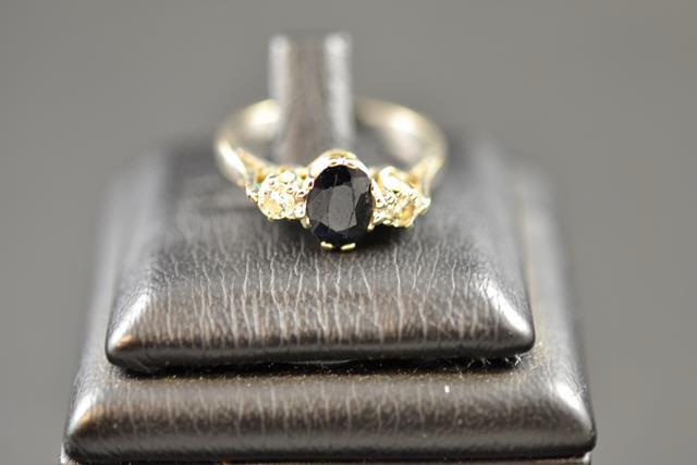 An 18ct white gold three stone sapphire and diamond ring - size N 1/2. CONDITION REPORT: