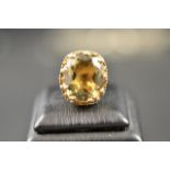 A 9ct gold ring set with large citrine in crown style mount - size L. CONDITION REPORT: Good