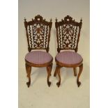 A pair of mid 19th century satin birch child's chairs, carved scroll crest rail, fret work splats,