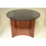 A 1970's Alessandro Albrizzi dining table, smoked glass top standing on sectional perspex base