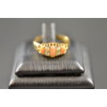 An 18ct gold ring set with coral and diamonds - size P 1/2. CONDITION REPORT: Good condition.