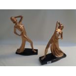 Pr. Of Art Deco Gilt painted semi nude dancers with black painted bases