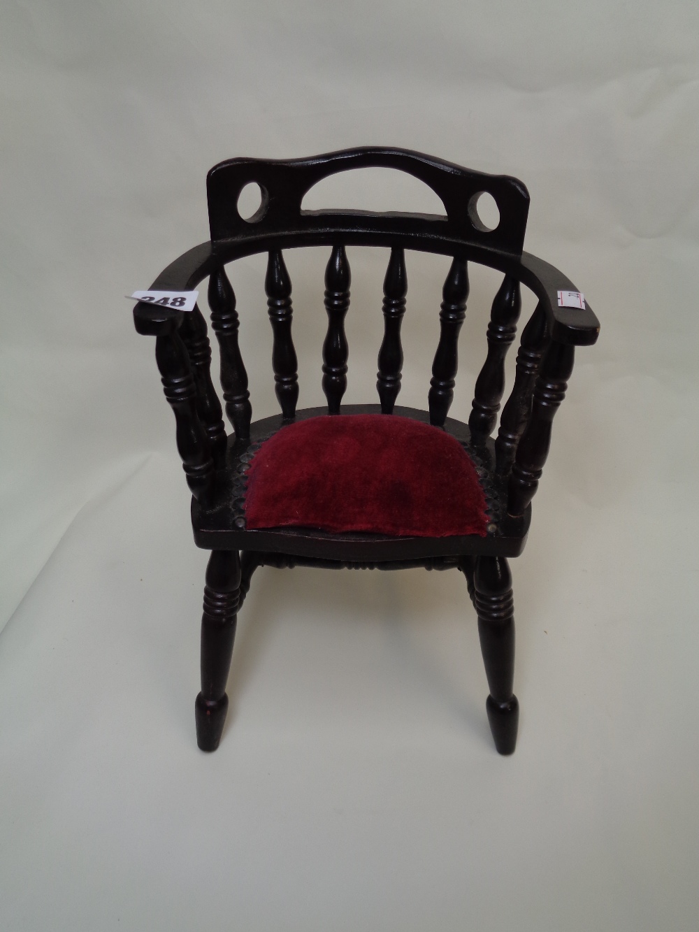 Dolls tub chair with spindle back and upholstered seat