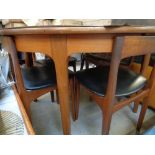 Retro Teak circular dining table with a set of 4 dining chairs
