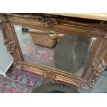 Large Gilt framed ornate wall mirror with bevel glass