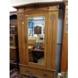 Arts & Crafts Oak Wardrobe with carved detail and bevelled mirror door over drawer base