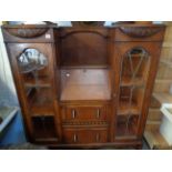 Oak Art Deco fall front bureau with glazed bookcase sides, carved ribbon and beaded decoration