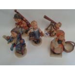 5 Hummel figurines of a Bass player, Boy with Telescope, Post girl, Boy with Shoes and boots and a