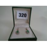 Pr. Of 9ct Gold Oval Emerald and White stone Cluster earrings