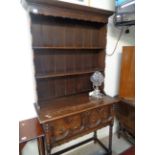 Oak 1920s Dresser of Diminutive form, plank back, Brass drop handles and bobbin turning