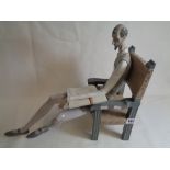 Lladro Figure of Don Quixote seated in elbow chair with book