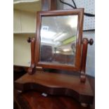 Victorian Walnut framed swing mirror and a Upholstered gout stool with turned supports