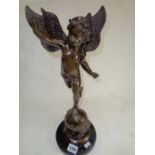 Unsigned Bronze of winged cherub on Globe with star decoration and marble base