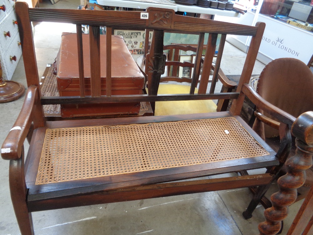 Edwardian Mahogany caned seat with carved stick back