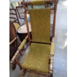 Early 20thC American rocking chair with upholstered seat, back and arms