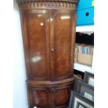 Good quality Walnut bow fronted corner cabinet with brushing slide