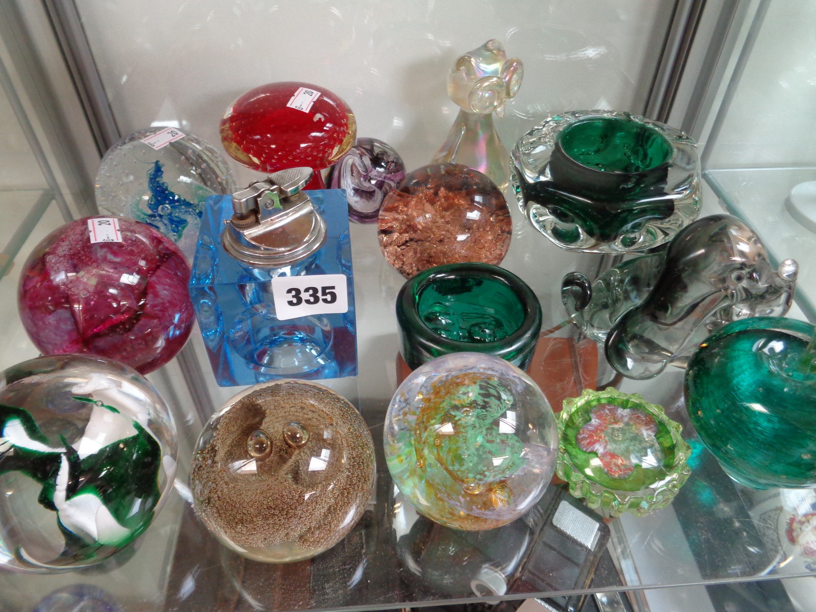 Collection of assorted Selkirk and other glass paperweights