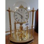 Good quality Rapport German Brass Anniversary clock under glass dome