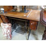 Singer Sewing machine by Singer with cast iron treadle base