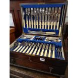 Good quality Oak cased canteen of cutlery with beaded decoration and drop handles by Viners Ltd of