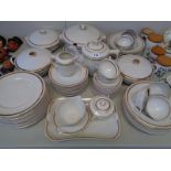 Extensive German white dinner service with gilt banding