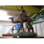 Large 20thC Bronze of a Camel back rider with hunting dog in naturalistic setting