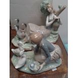 Boxed Lladro figure 'Cornida a los Patos' and another Lladro figure of a Woman recumbent with 3