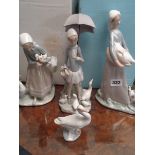 Lladro figure of a woman with goose and puppy, Lladro figure of girl with umbrella and ducks, Lladro