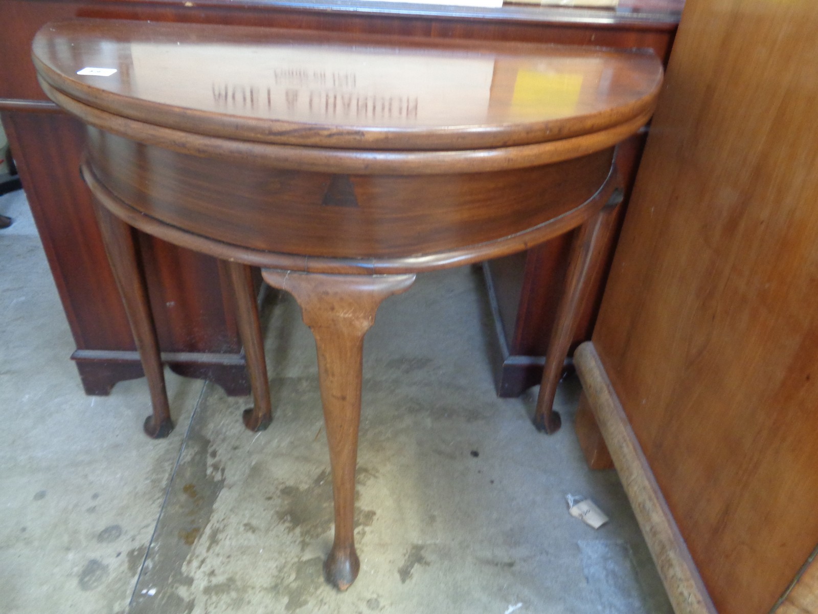 Edwardian Mahogany fold over tea table on long cabriole legs