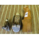 Two figures eagles and a wooden owl figure